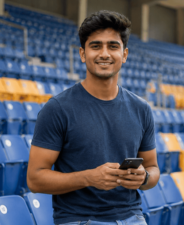 Fan in a stadium with a phone